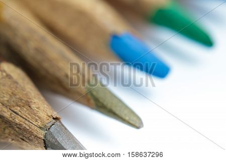 Colored pencils sharpened by hand closeup. Selective focus
