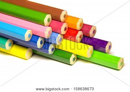 a stack of colored pencils on a white background isolated