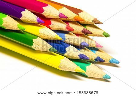 a stack of colored pencils on a white background isolated