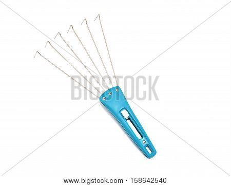 Hand cultivator of the soil for the garden isolated on a white background for the garden