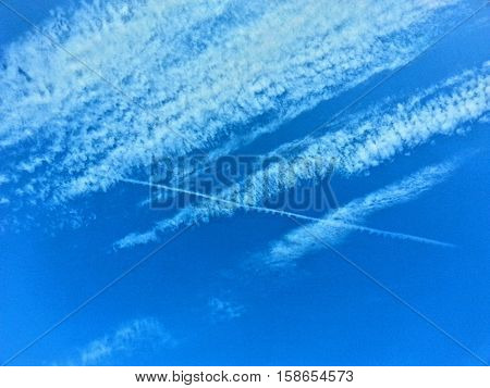 a blue sky with little white clouds