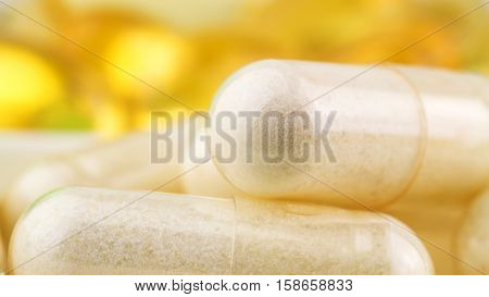 Natural food supplement pills glucosamine and omega 3 capsules macro image