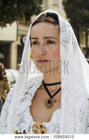 QUARTU S.E., ITALY - September 21, 2014: Parade of Sardinian costumes and floats for the grape festival in honor of the celebration of St. Helena. - Sardinia - portrait of a beautiful woman in traditional Sardinian costume