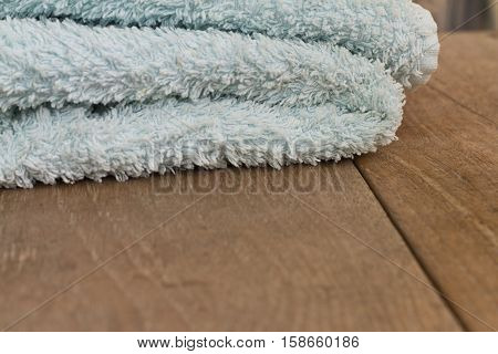Towel on a wooden table. Photographed close-up