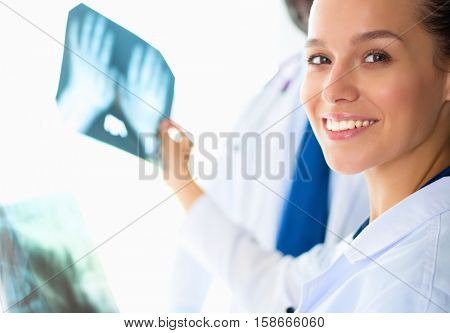 Doctors analyzing an x-ray in a meting