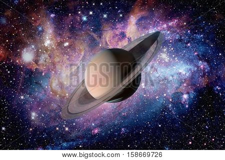 Solar System - Saturn. It is the sixth planet from the Sun and the second-largest in the Solar System. It is a gas giant planet and has a ring system. Elements of this image furnished by NASA.