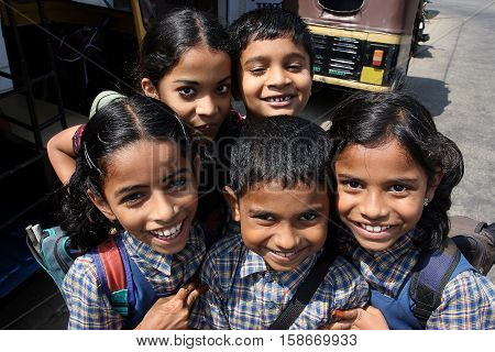 KOCHI, INDIA - FEB 15, 2009: Unidentified Indian schoolchildren having fun together after school on 15 February, 2009. Kerala state is Malayalam-speaking region with 33387677 inhabitants