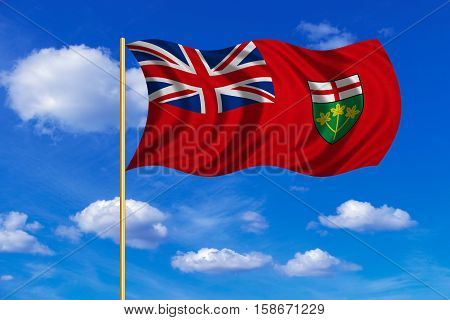 Ontarian provincial flag patriotic element official symbol. Canada banner. Correct color. Flag of the Canadian province of Ontario on flagpole waving in the wind blue sky background. Fabric texture. 3D rendered illustration