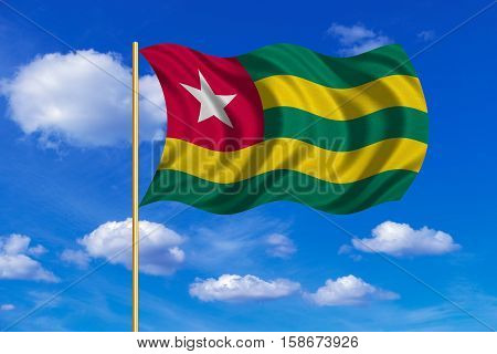 Togolese national official flag. African patriotic symbol banner element background. Correct colors. Flag of Togo on flagpole waving in the wind blue sky background. Fabric texture. 3D rendered illustration