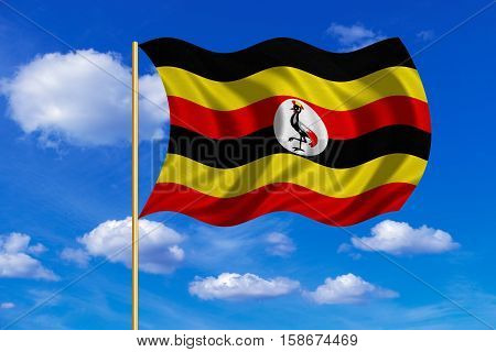 Ugandan national official flag. African patriotic symbol banner element background. Correct colors. Flag of Uganda on flagpole waving in the wind blue sky background. Fabric texture. 3D rendered illustration