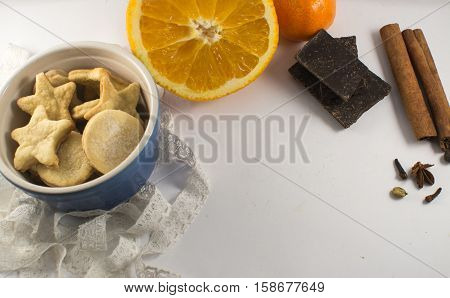 biscuits spices and chocolade on the white backgraund