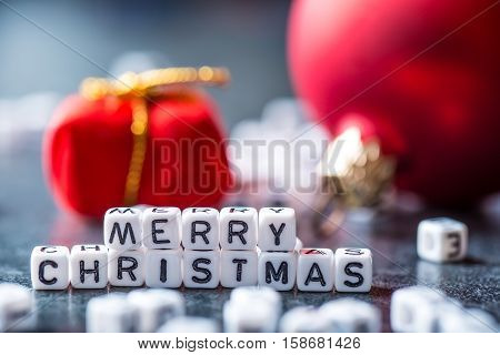 Christmas. Christmas Time. Christmas decoration.The words Merry Christmas with red christmas decorations.