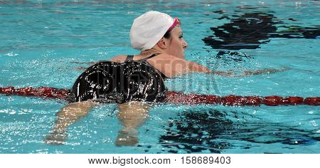 Hong Kong China - Oct 29 2016. Australian olympian and world champion swimmer Emily SEEBOHM (AUS) on the buoy lane markers. FINA Swimming World Cup Preliminary Heats Victoria Park Swimming Pool.
