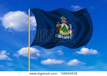 Flag of the US state of Maine. American patriotic element. USA banner. United States of America symbol. Mainer official flag on flagpole waving in the wind blue sky background. Fabric texture. 3D rendered illustration