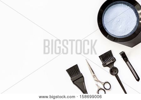 Tools for hair dye and hairdye top view on white background