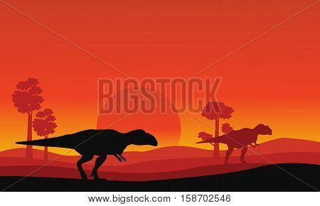 Silhouette of mapusaurus orange sky scenery collection stock