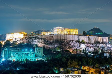 Parthenon and Herodium construction in Acropolis Hill in Athens, Greece shot in blue hour
