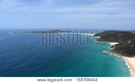 Shark Island and coastline of Shoal bay on a sunny day from Mount Tomaree Lookout (Central Coast NSW Australia)