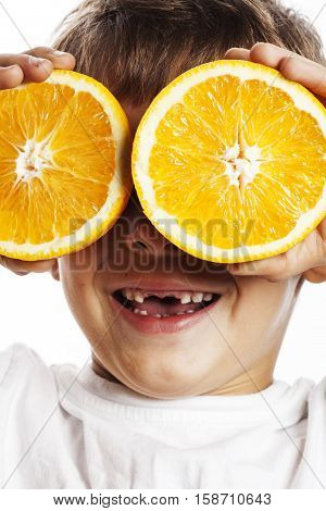 little cute boy with orange fruit double isolated on white smiling without front teeth adorable kid cheerful close up