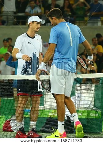 RIO DE JANEIRO, BRAZIL - AUGUST 14, 2016: Juan Martin Del Potro (R) congratulates Olympic champion Andy Murray of Great Britain with his victory at men's singles final of the Rio 2016 Olympic Games