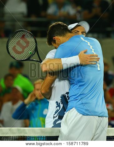 RIO DE JANEIRO, BRAZIL - AUGUST 14, 2016: Juan Martin Del Potro (R) congratulates Olympic champion Andy Murray of Great Britain with his victory at men's singles final of the Rio 2016 Olympic Games