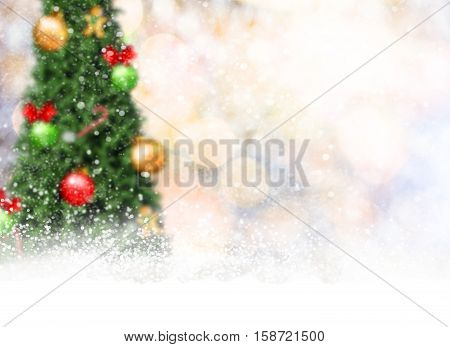 blur christmas tree and gold bokeh with snowflake. concept festive banner background.