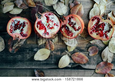 Ripe Pomegranate Fruit On Wooden Vintage Background. Red Juice P