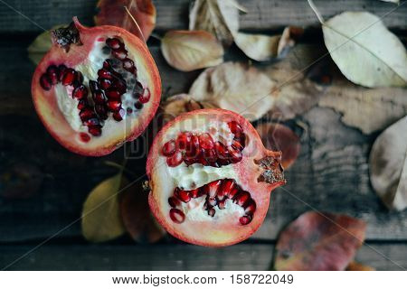 Ripe Pomegranate Fruit On Wooden Vintage Background. Red Juice P