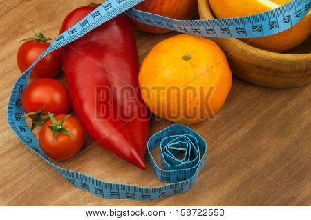 Vegetables and fruits on a wooden table. Diet concept. Healthy food. Raw food diet. Weight loss and healthy diet.