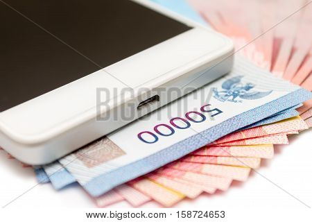 Smartphone And Money Of Indonesian Rupiah