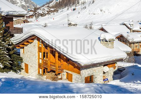 Alpine winter mountain landscape. French Alps covered with snow in sunny day. Val-d'Isere, France