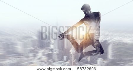 B-boy performing some moves . Mixed media