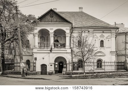 Kyiv Ukraine - November 26 2016: Facade of an ancient building. The house of Peter the Great located in Podil district of Kyiv Ukraine. Black and white photography sepia toned.