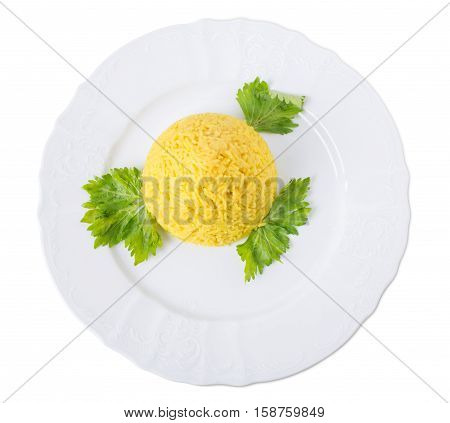 Delicious rice with curry and fresh parsley. Isolated on a white background.