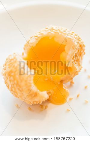 Chinese dim sum Fried sesame balls stuff with custard lava - Chinese groumet cuisine