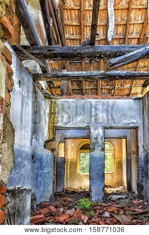 destroyed old house room ruins. Indoor view