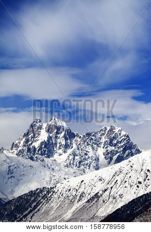 Mounts Ushba And Chatyn And Blue Sky With Clouds In Winter Wind Day