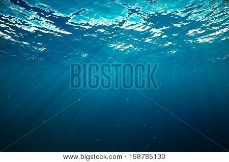 3d rendering underwater with sunrays and in deep tropical sea