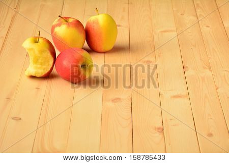 Apple on wood table at the morning.