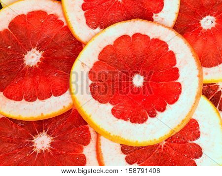 Texture of a ripe grapefruit slice, closeup