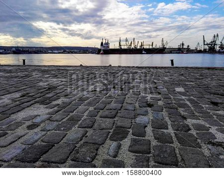 Photo of harbor cranes and sunset. Suitable for background.