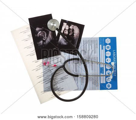 Ultrasound scan of baby with stethoscope and laboratory test on white background