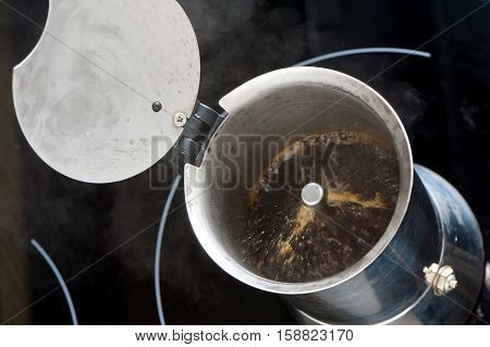 brewing morning hot coffee in moka pot