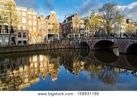 Dutch scenery with canal and mirror reflections at spring, Amstardam, Netherlands, toned