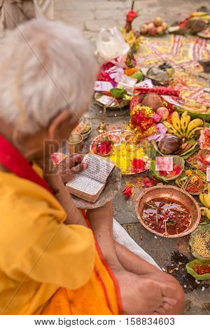 Kathmandu, Nepal - May 21, 2016: Brahmin make hindu puja ceremony in Kathmandu, Nepal