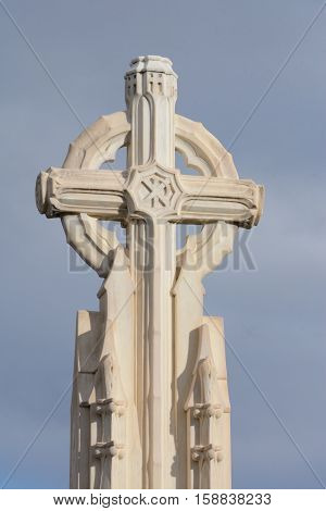 Stone Christian memorial cross with Christogram 