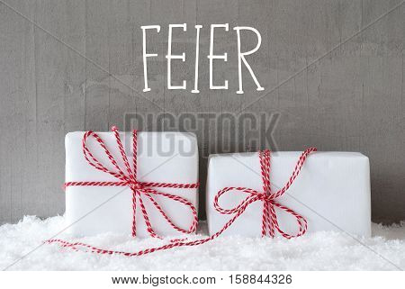German Text Feier Means Celebration. Two White Christmas Gifts Or Presents On Snow. Cement Wall As Background. Modern And Urban Style.