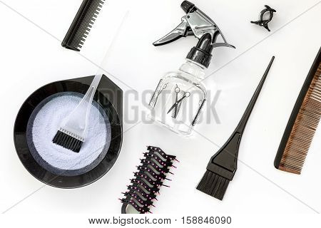 Tools for hair dye and hairdye top view on white background