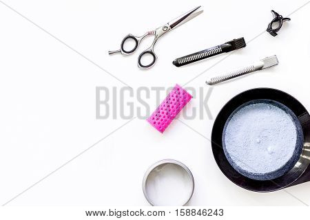 Tools for hair dye and hairdye top view on white background