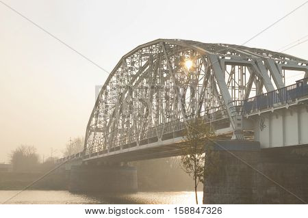 Poland Krakow Steel Railway Bridge over Vistula river afternoon sunlit